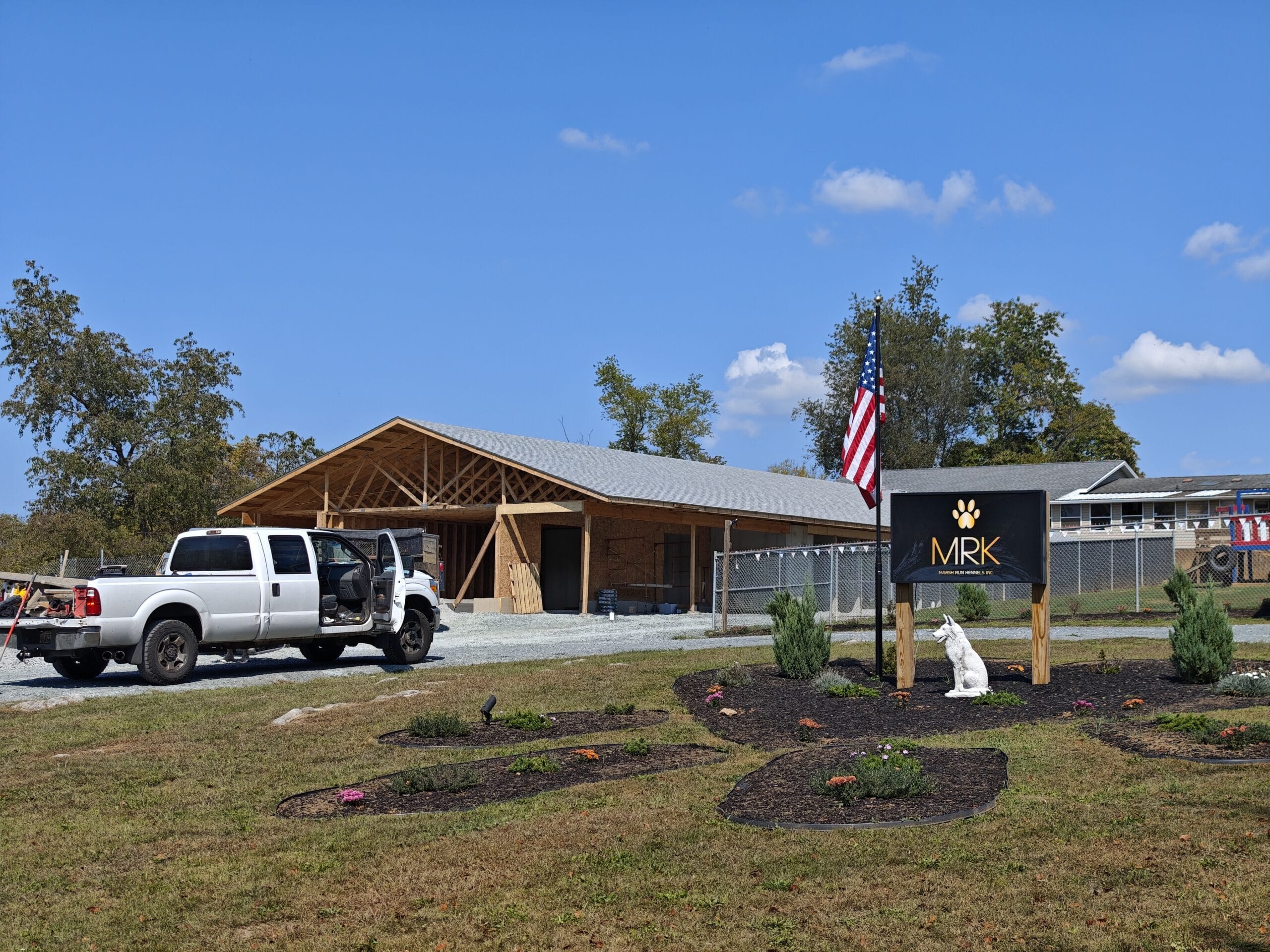 Marsh Run Kennels new building in progress. Open view with the roof being installed.