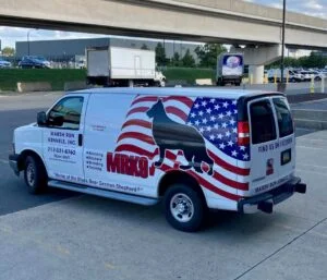 Transport Van White transport van with MRK9 logo, on an American Flag with a silhouette of a German Shepherd.